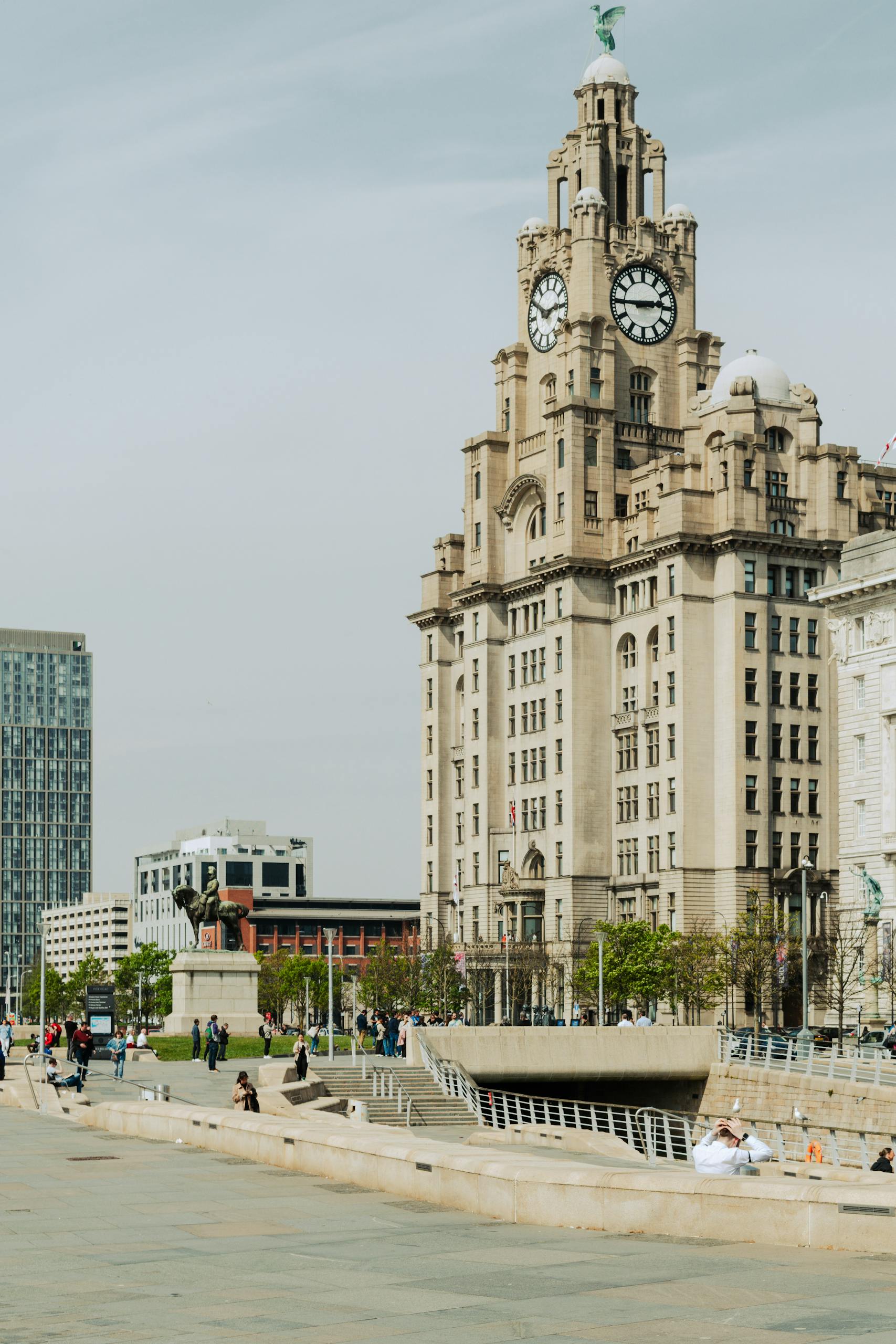 The historic Royal Liver Building in Liverpool, England, under a clear sky.