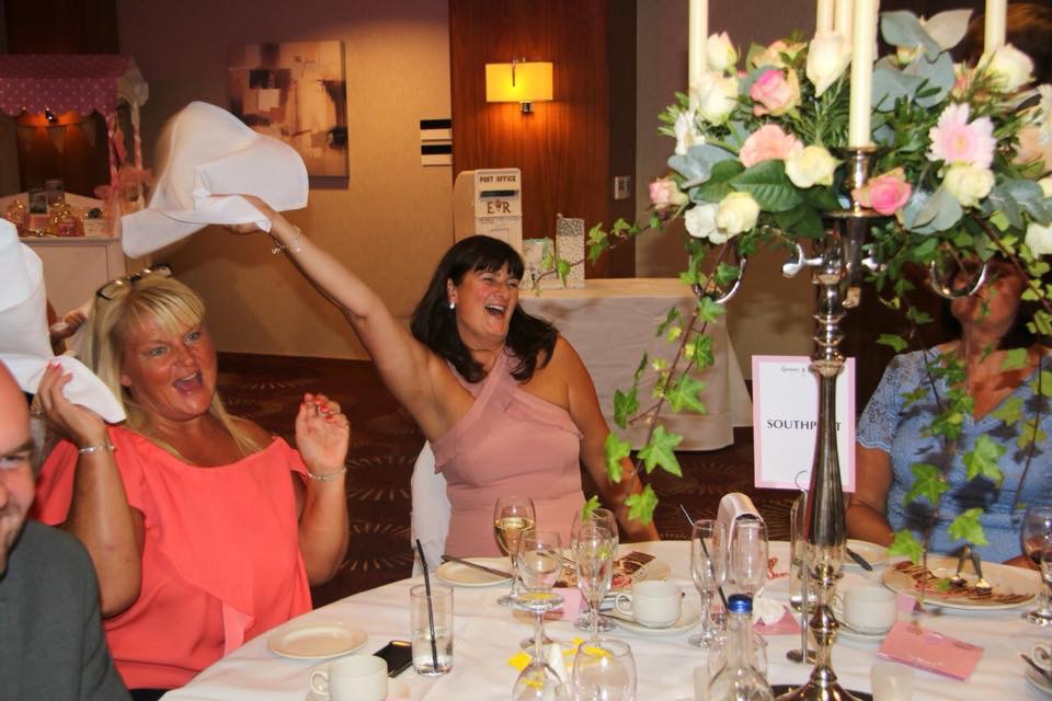 Wedding Guests enjoying themselves singing and dancing to the singing waiters