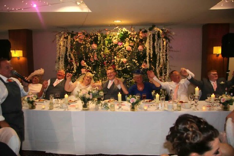The top table having a ball during their wedding breakfast entertainment